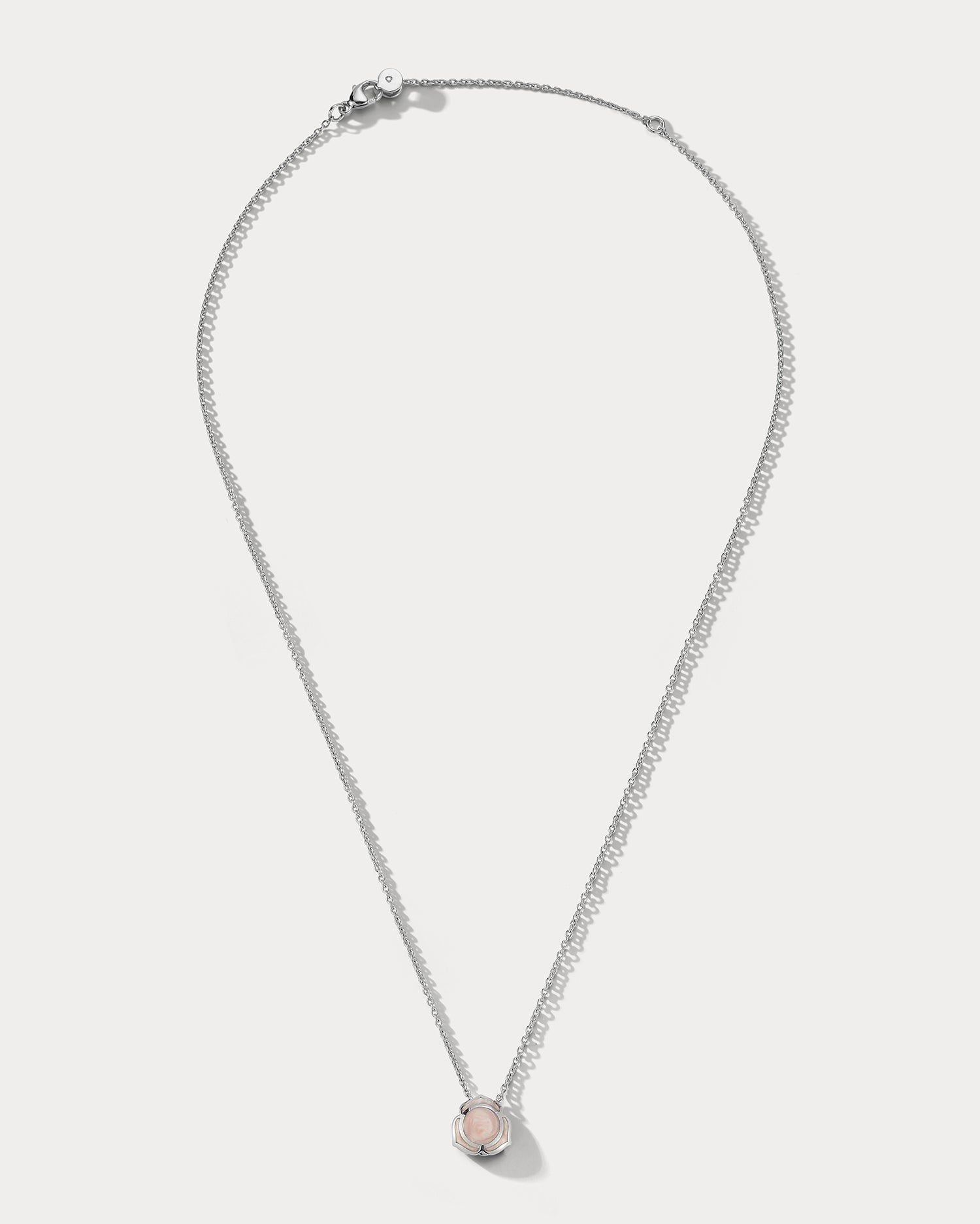 Ammrada Heartnote white gold and pink ceramic pendant necklace with a delicate heart-shaped design.