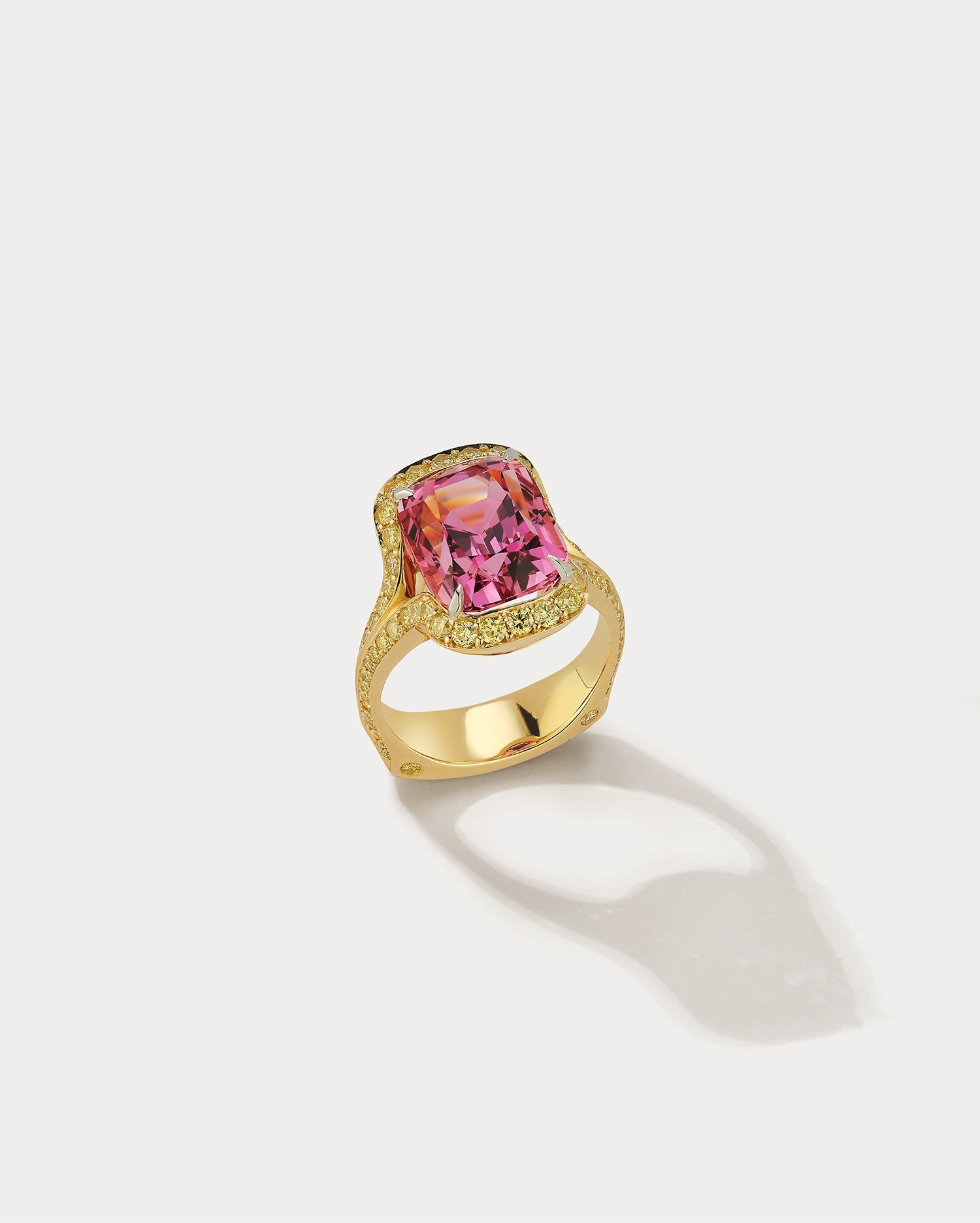 Ammrada Peachy Pink Spinel ring featuring a vibrant pink spinel gemstone set in a sleek metal band.