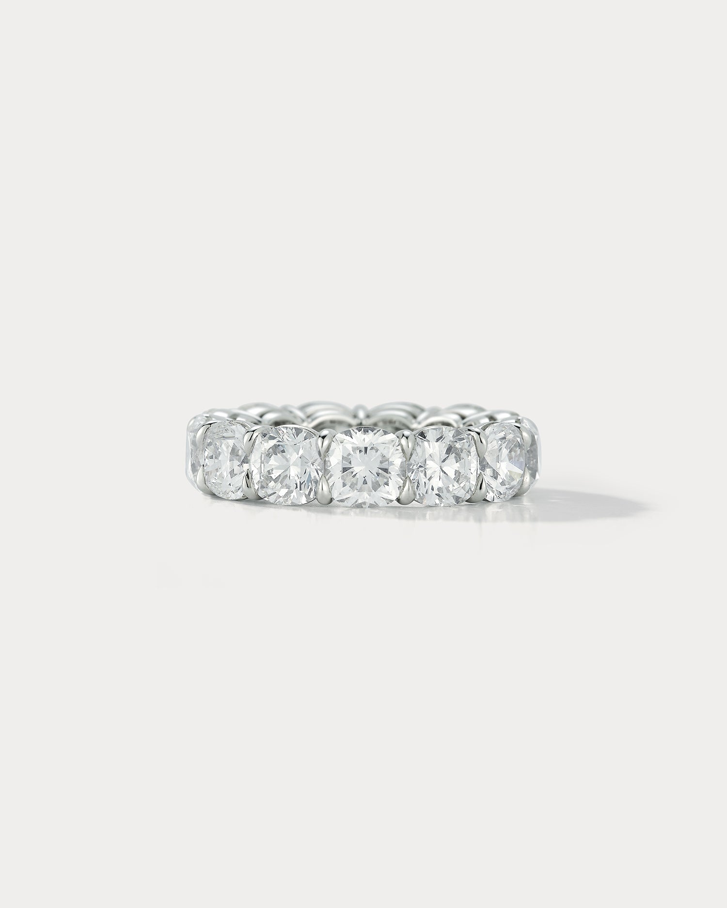 Ammrada diamond cushion cut wedding band ring with sparkling diamonds set in a sleek gold band.