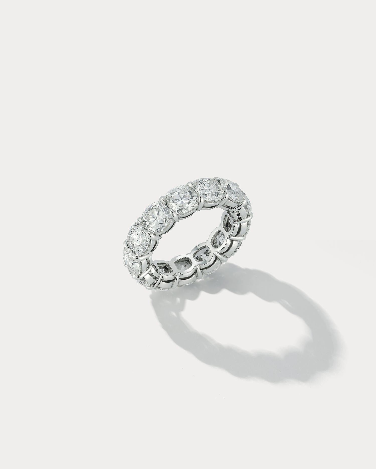 Ammrada diamond cushion cut wedding band ring with sparkling diamonds and a sleek metal band design.