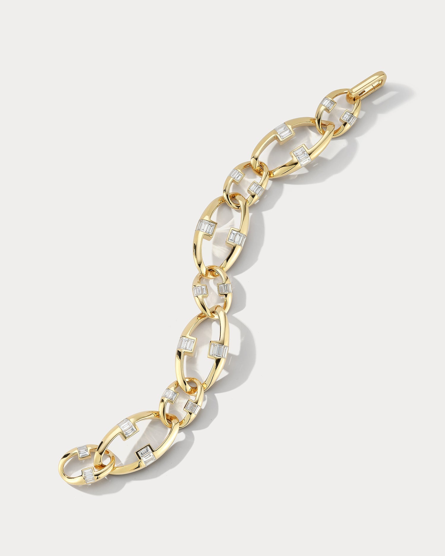Ammrada yellow gold diamond link bracelet with elegant design, showcasing polished gold links and sparkling diamonds.