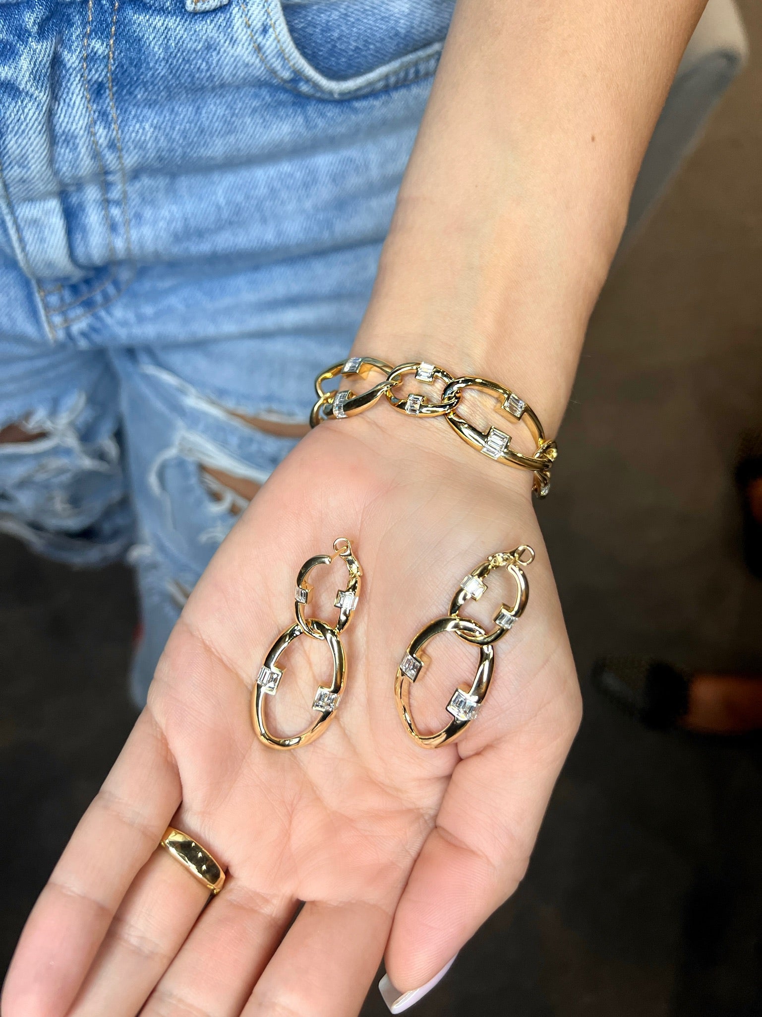 Ammrada yellow gold diamond link bracelet with intricate chain design and sparkling diamond accents on a white background.