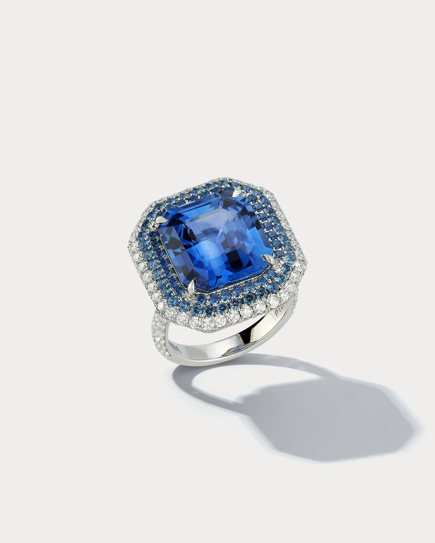 Ammrada 12ct emerald-cut sapphire ring featuring a central blue sapphire gemstone set in a stylish ring design.