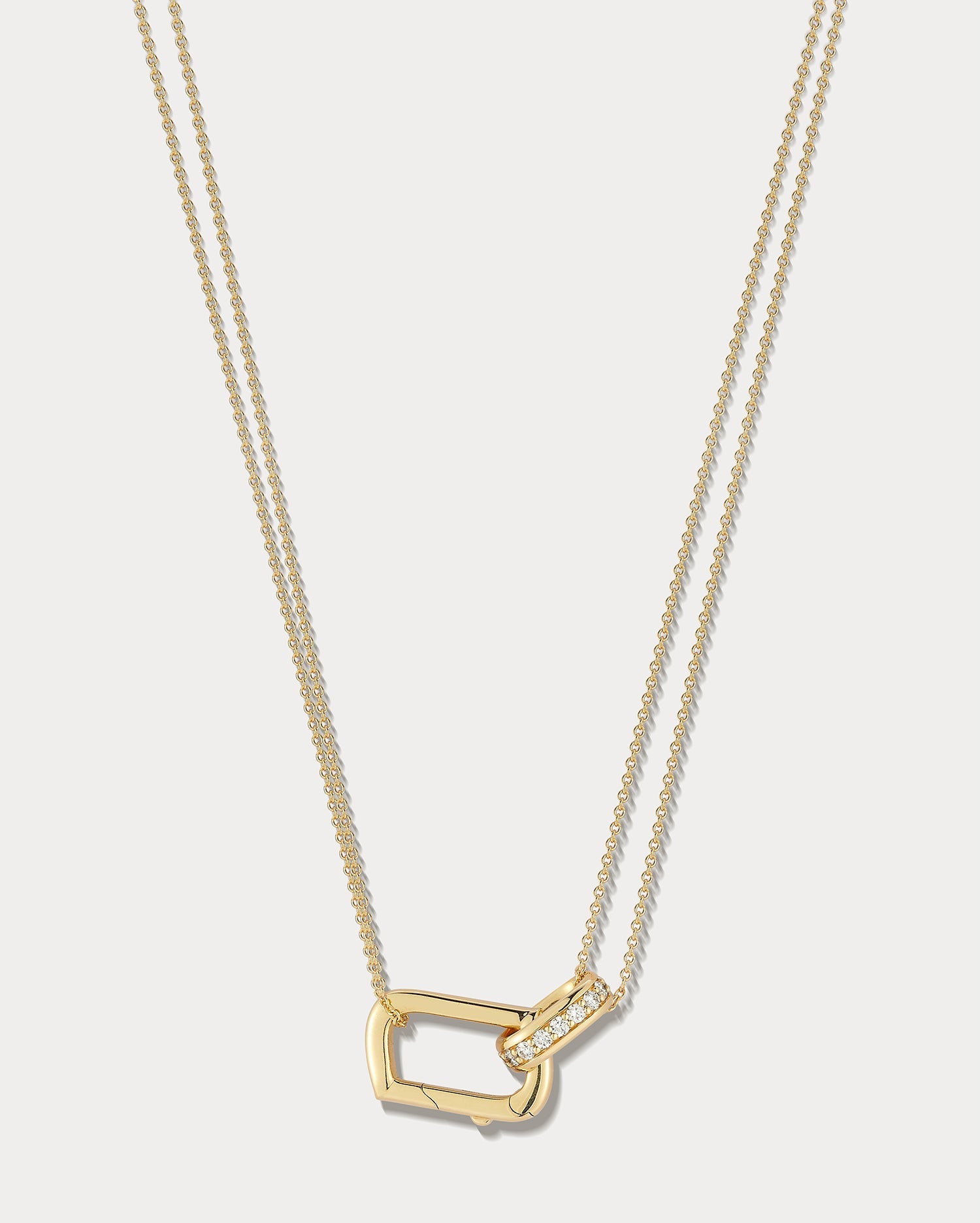 Yellow gold and diamond convertible locket necklace, 16 inches, by Ammrada, featuring intricate design and sparkling accents.