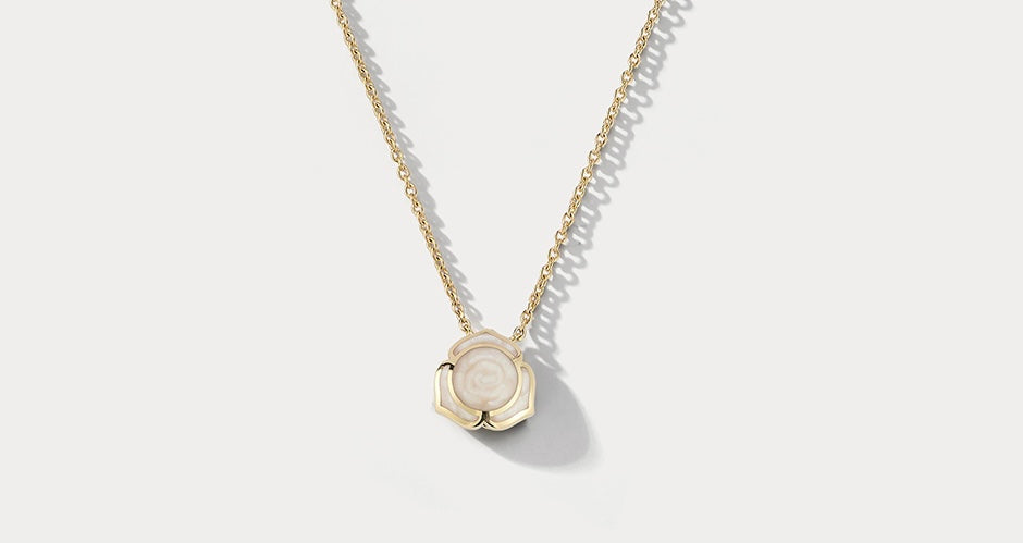 Ammrada Heartnote yellow gold and pearl ceramic pendant necklace featuring a delicate heart-shaped design with gold and pearl accents