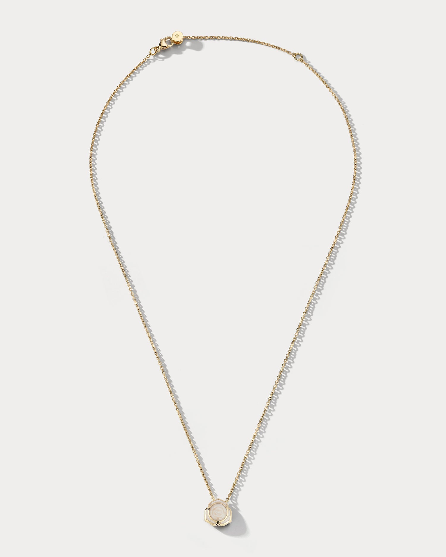 Ammrada Heartnote yellow gold and pearl ceramic pendant necklace with a delicate heart-shaped design.