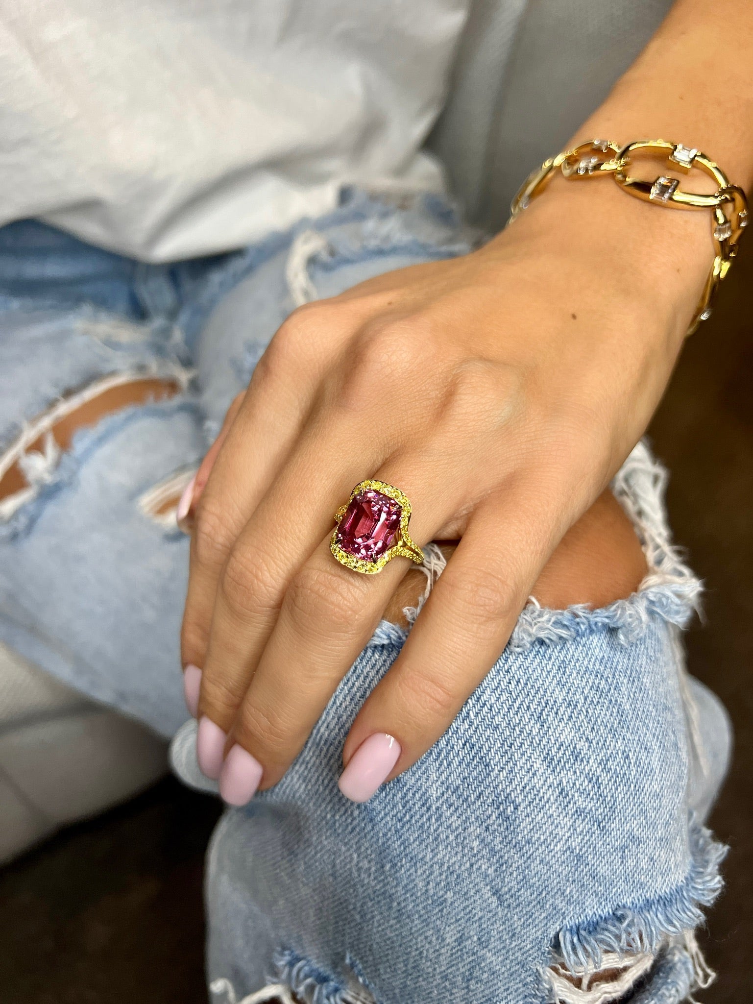 Ammrada Peachy Pink Spinel ring showcasing a vibrant pink spinel gemstone set in a delicate metal band.