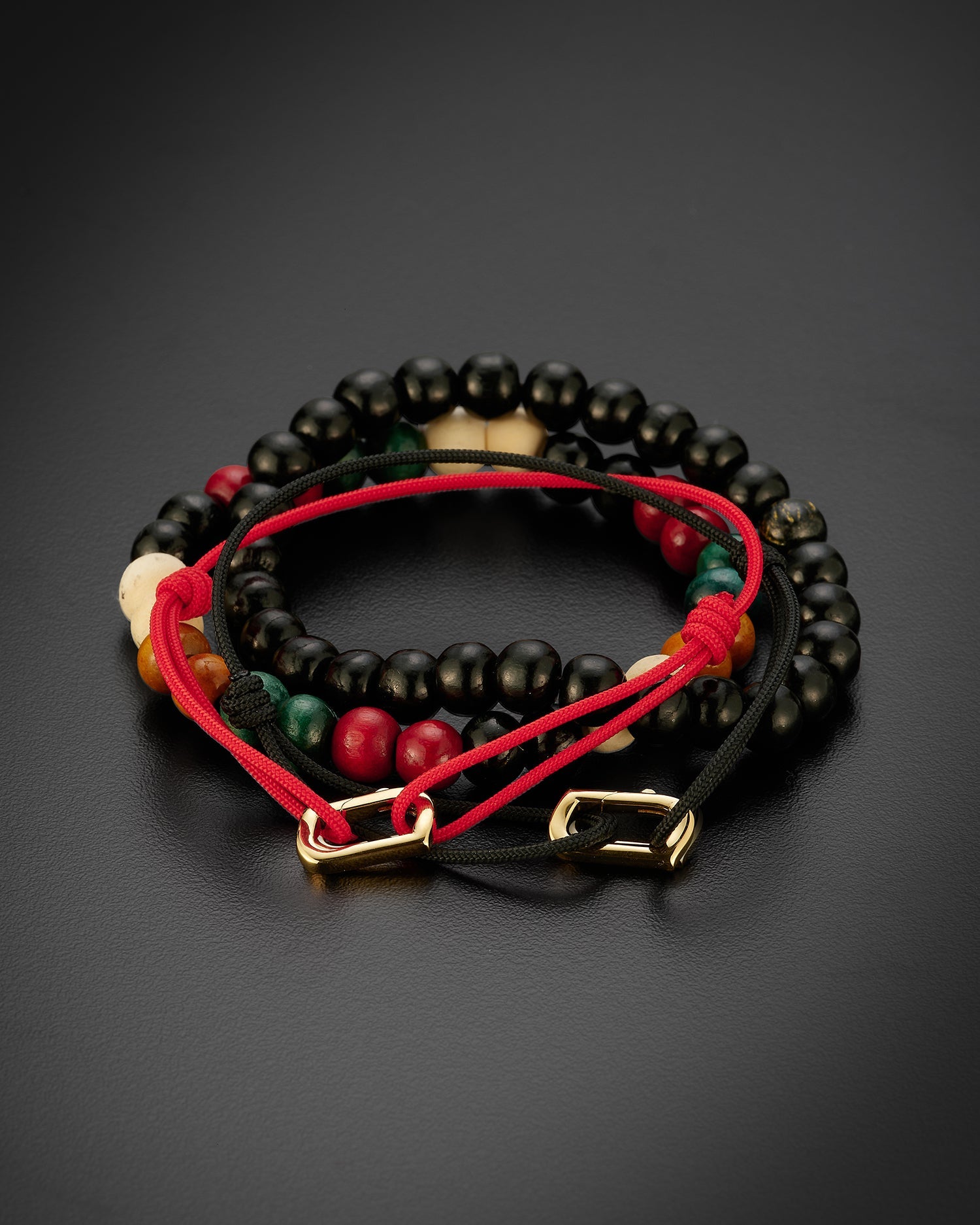 Ammrada infinity bracelet featuring Japanese silk in black or red, accented with 18K yellow gold detailing.