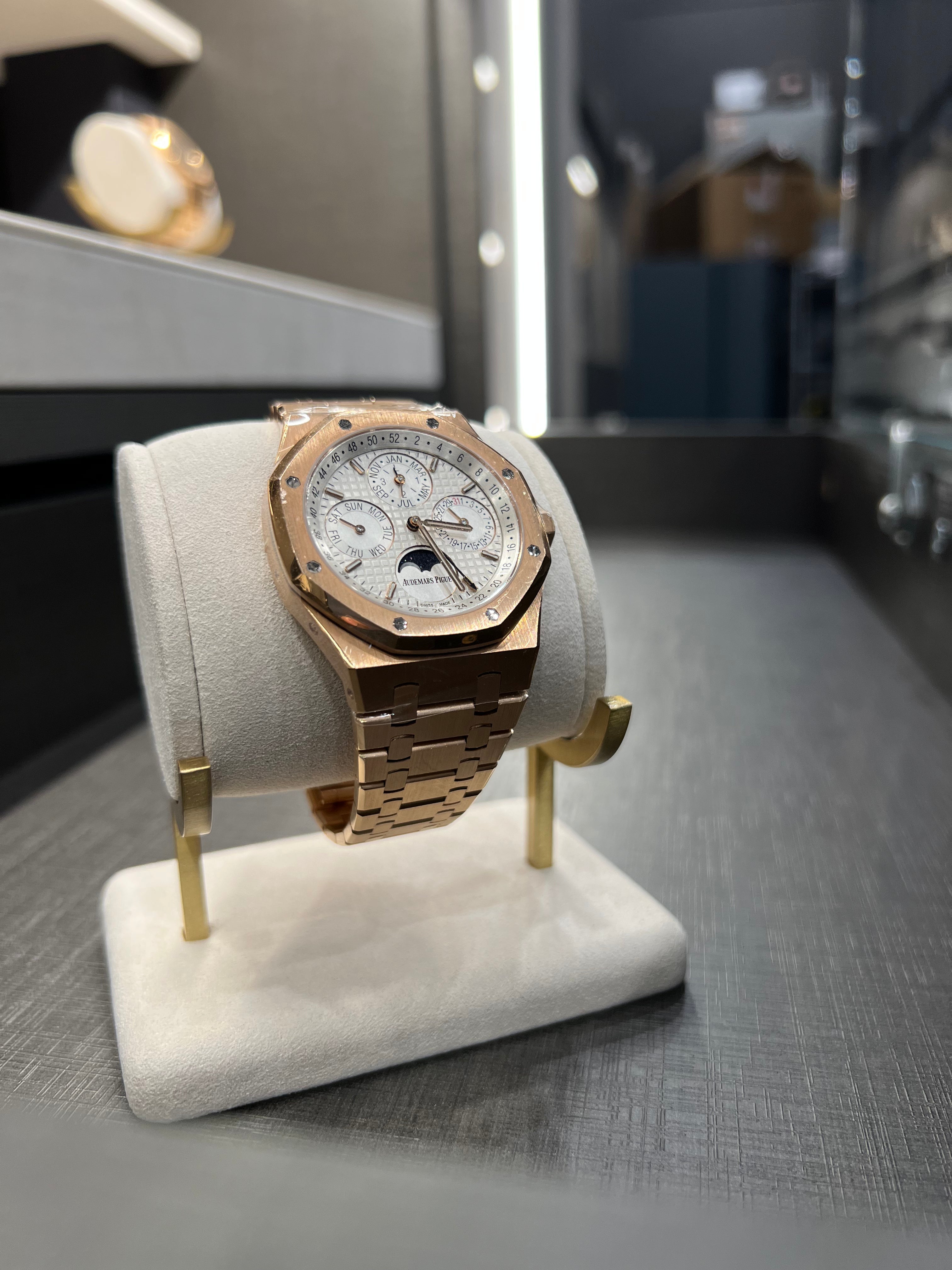 Audemars Piguet Royal Oak Perpetual Calendar watch with gold case, black dial, and visible intricate complications.