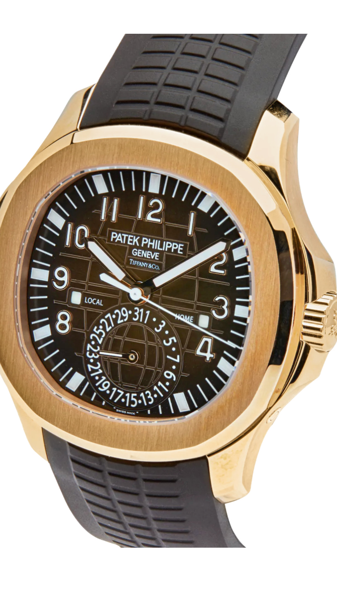 Patek Philippe Aquanaut Travel Time 5164R-001 watch with Tiffany & Co branding, silver dial, and brown strap.