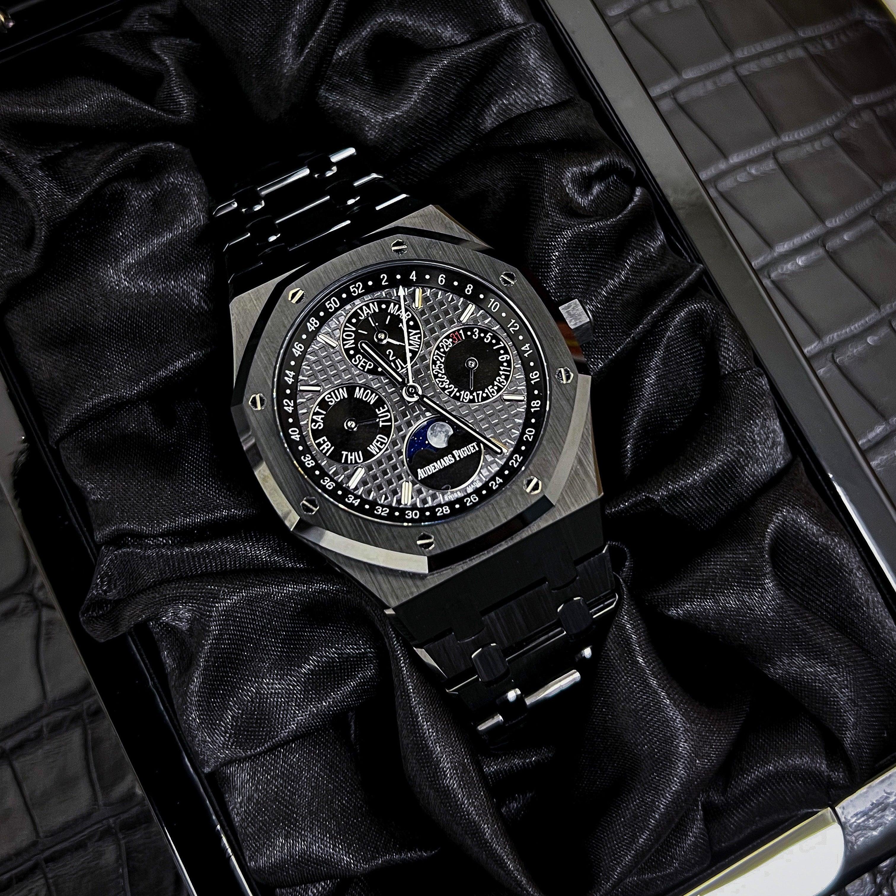 Audemars Piguet Royal Oak ceramic perpetual calendar watch with silver dial, black ceramic case, and detailed subdials.